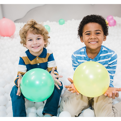 Two Boys Playing in Ball Pit