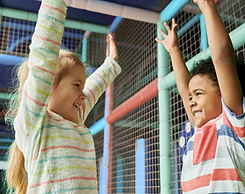 One Boy and One Girl Playing in the Indoor Playground