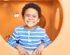 Boy Smiling in Indoor Playground